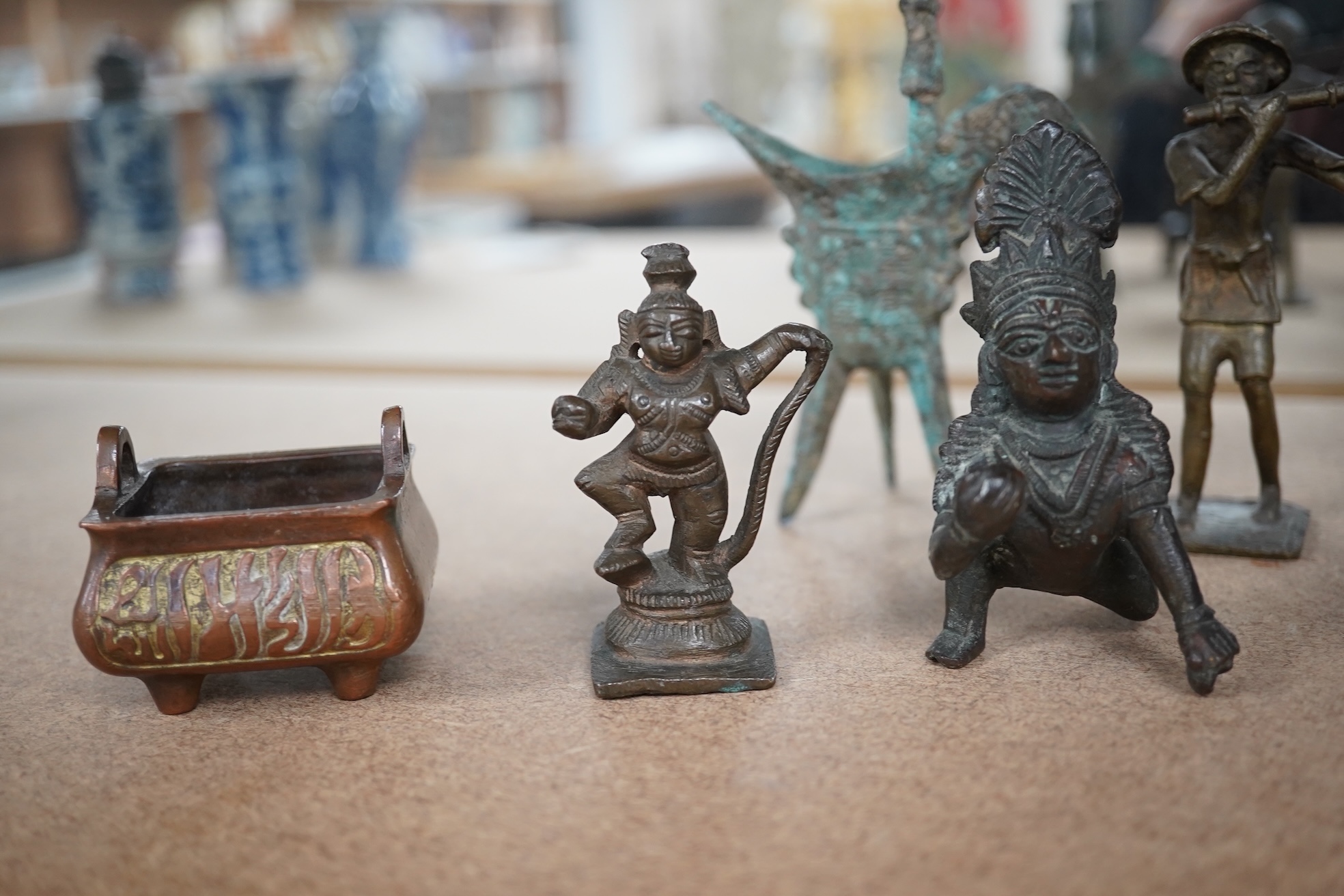 A group of Chinese and Indian bronze figures and vessels, 19th century and later, tallest 12cm. Condition - varies